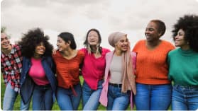 seven women happily smiling at the camera