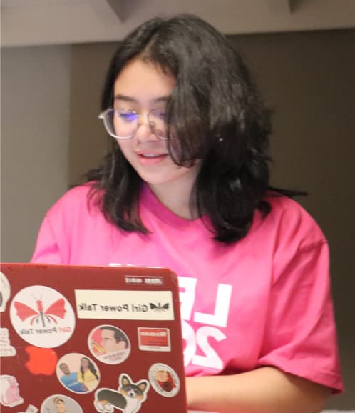 Women sitting and coding